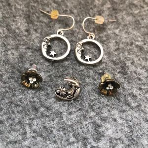 2 pairs of earrings and one single earring